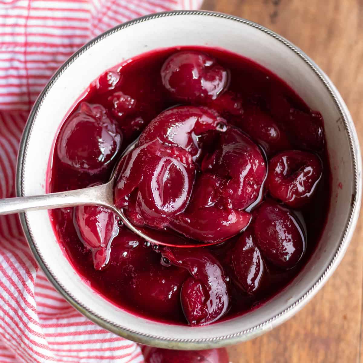 Dish of compote with a spoon.