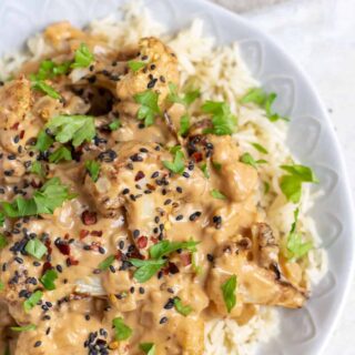 Roasted cauliflower in a peanut sauce on rice.