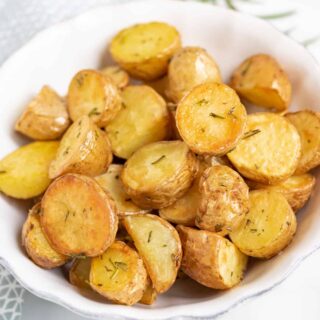 A bowl of roasted potatoes.