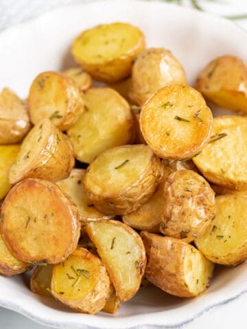 A bowl of roasted potatoes.