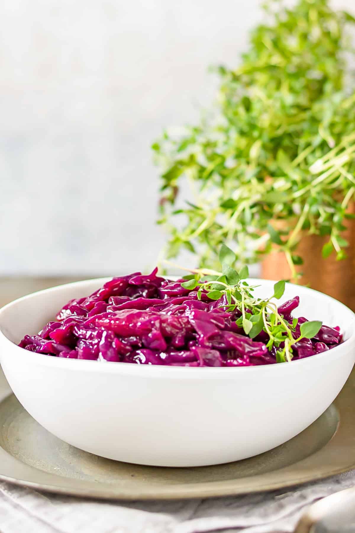 Table with a dish of spiced red cabbage.