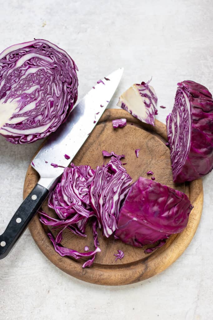Shredding cabbage with a knife.