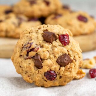 A cookie in front of a pile of them.