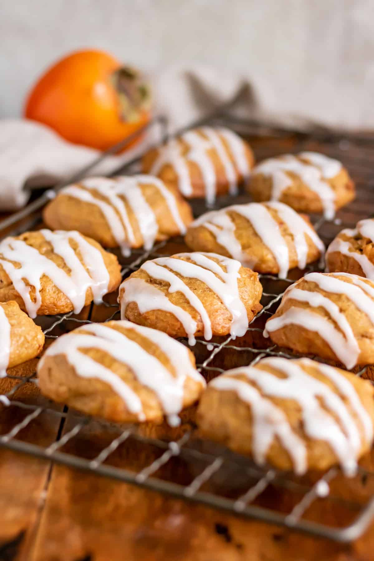 Rows of cookies with icing drizzled on them.