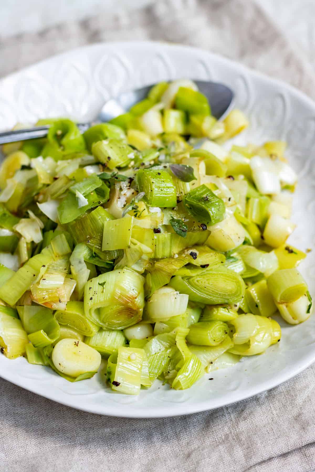 Serving dish of chopped, cooked leeks.