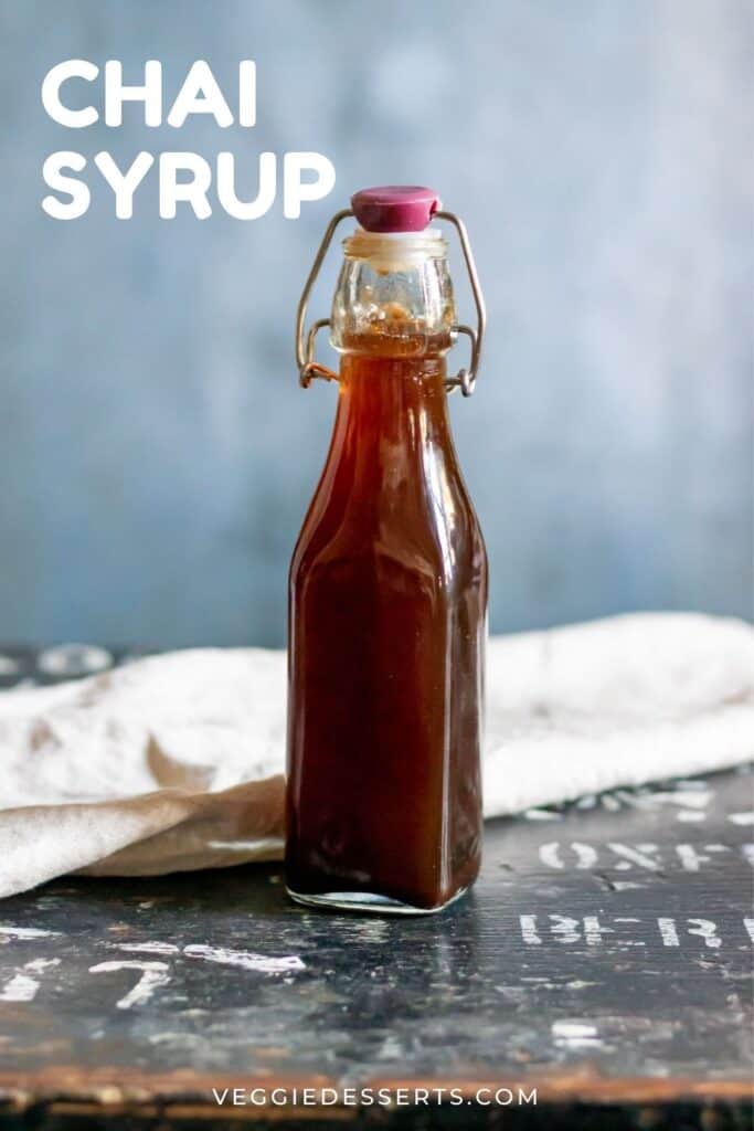 Glass bottle of syrup, with text: Chai Syrup.