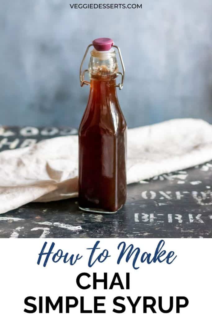 Bottle of syrup on a table, with text: How to make chai simple syrup.