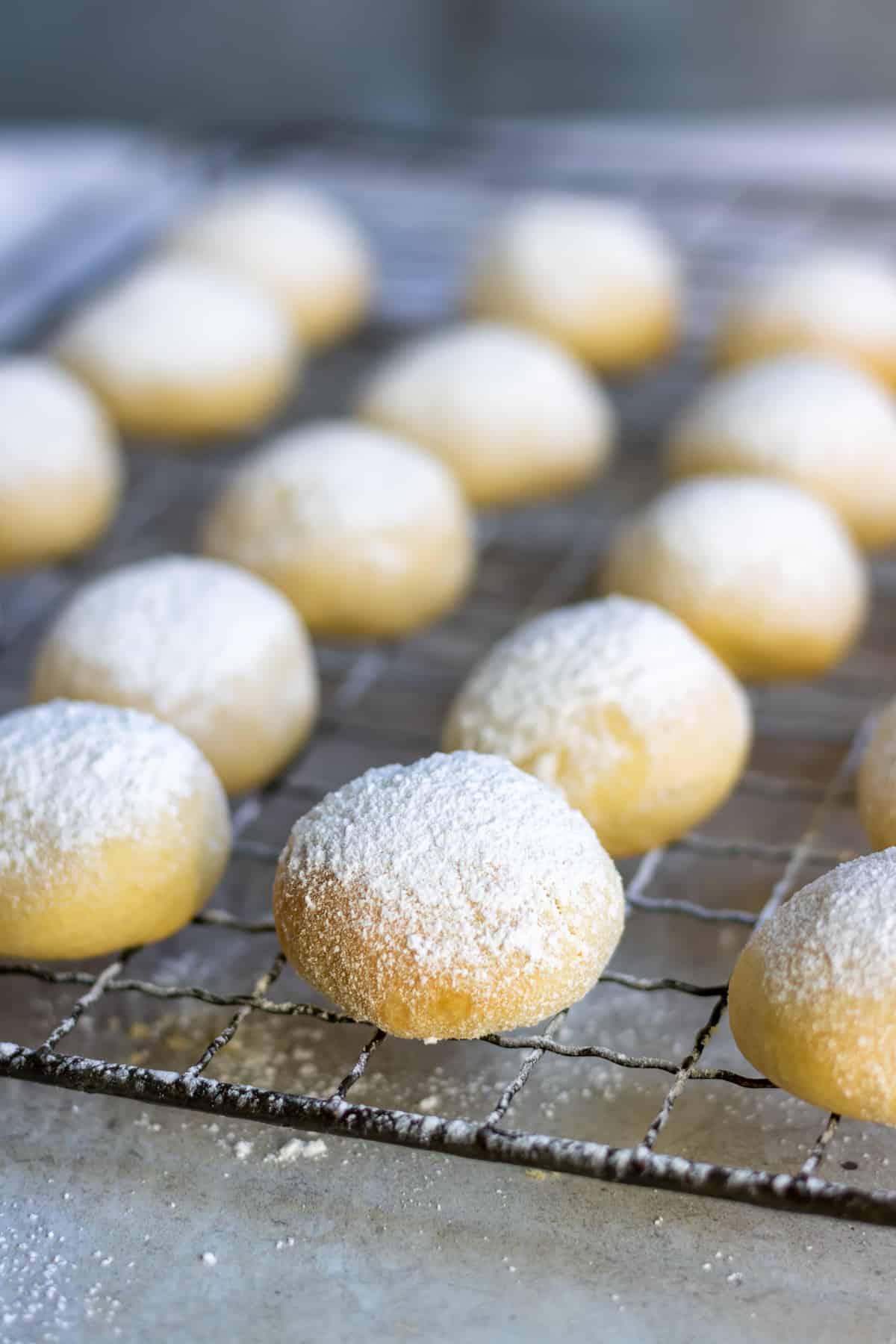 Balls of shortbread cornstarch cookies dusted with powdered sugar.