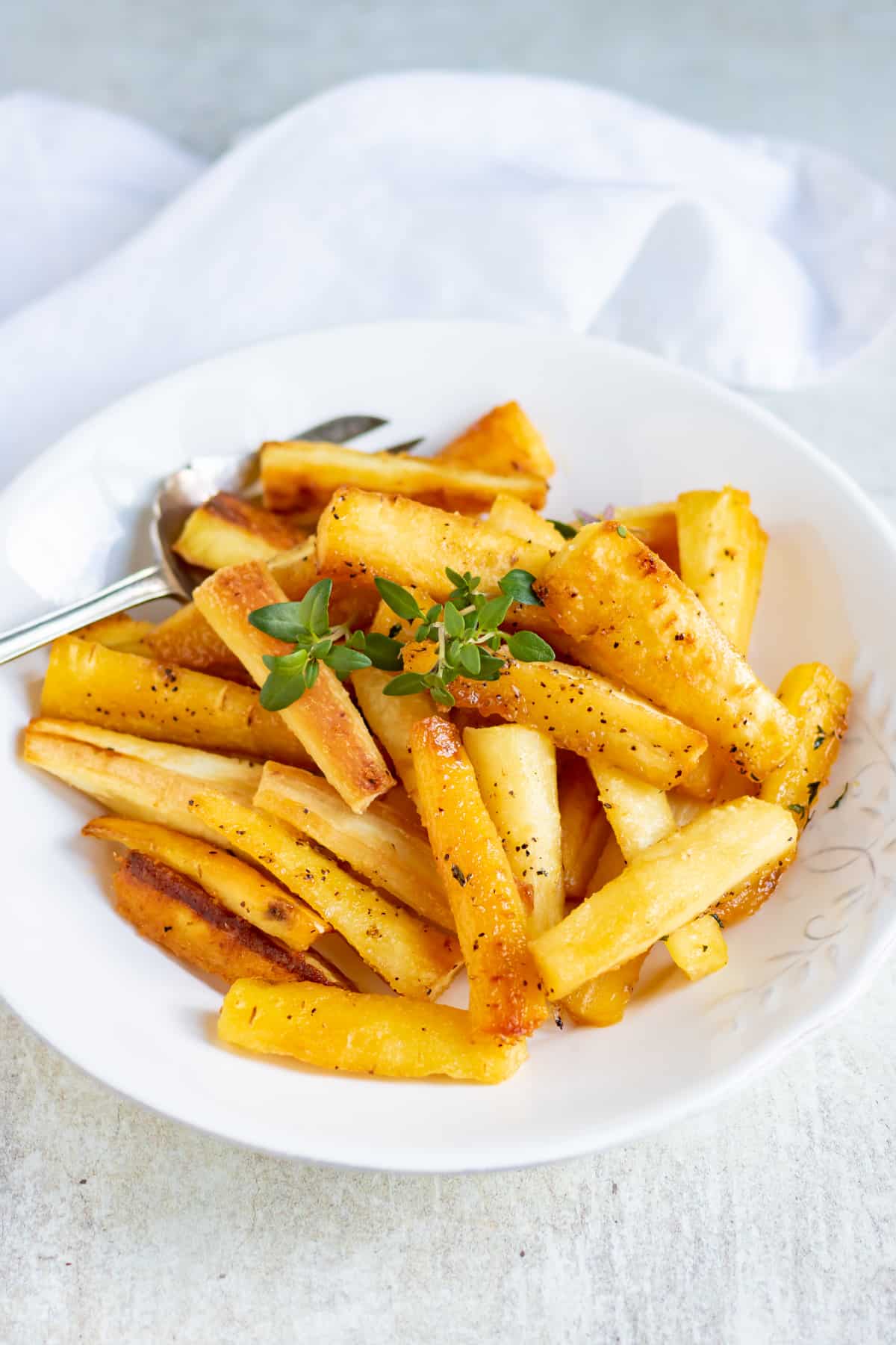 A dish of honey roasted parsnips.