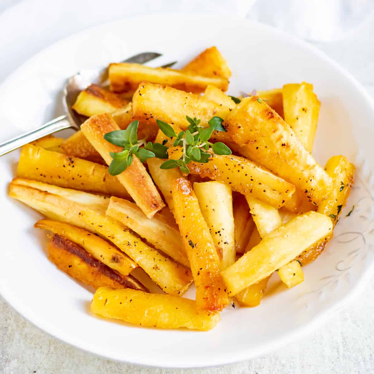 A dish of honey roasted parsnips.
