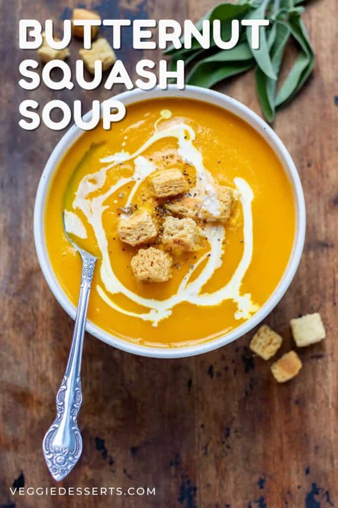 A bowl of soup with a spoon, with text: Butternut Squash Soup.