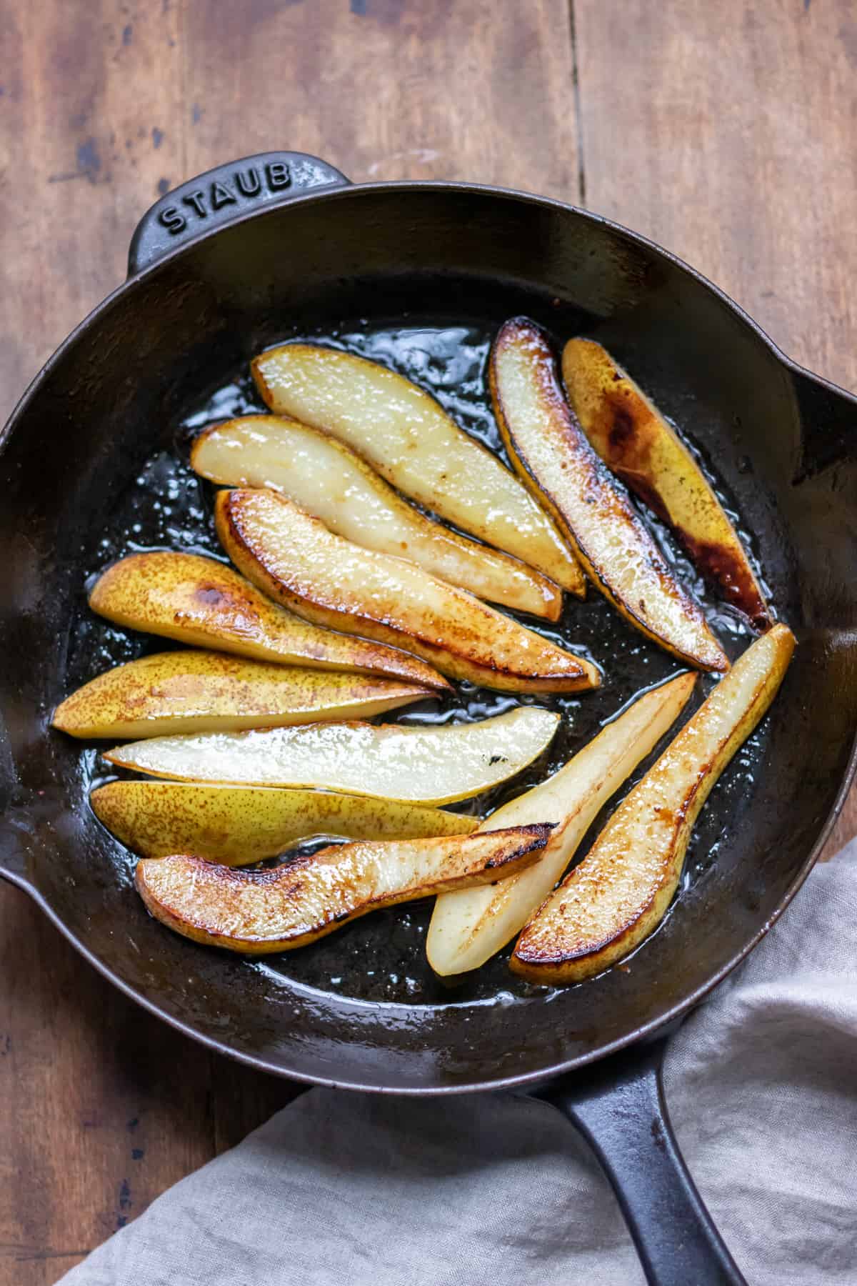 Skillet of cooked pear slices.