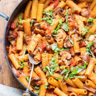 Serving spoon in a dish of mushroom ragu.
