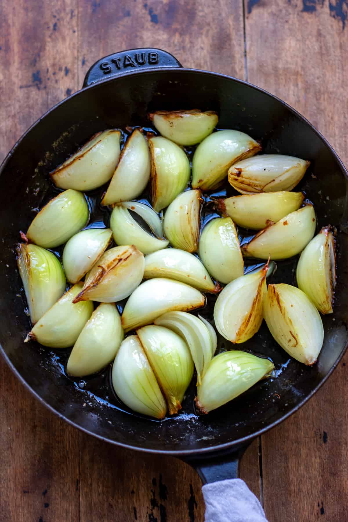 Cooking onions in a skillet.