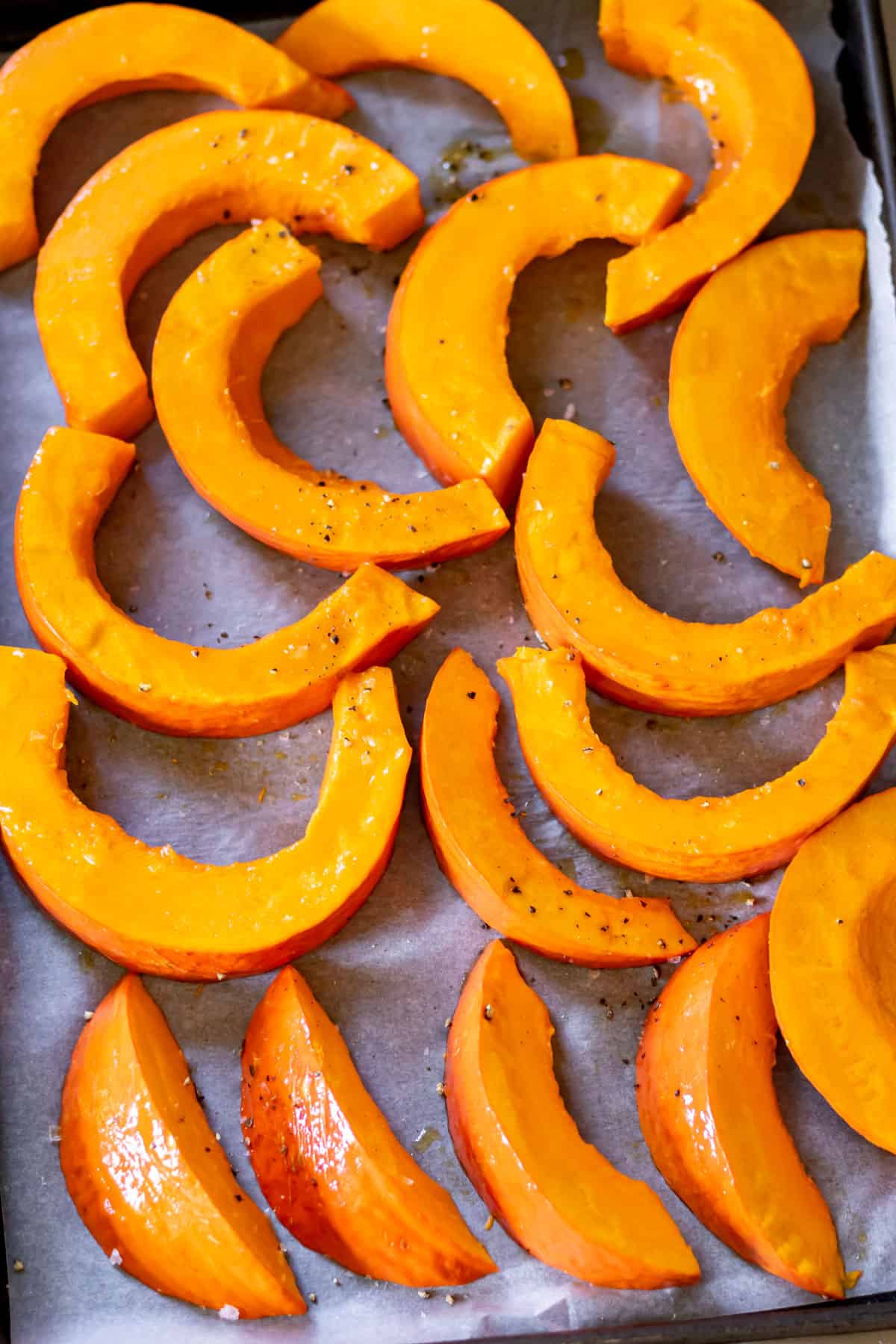 Slices of squash on a baking sheet.