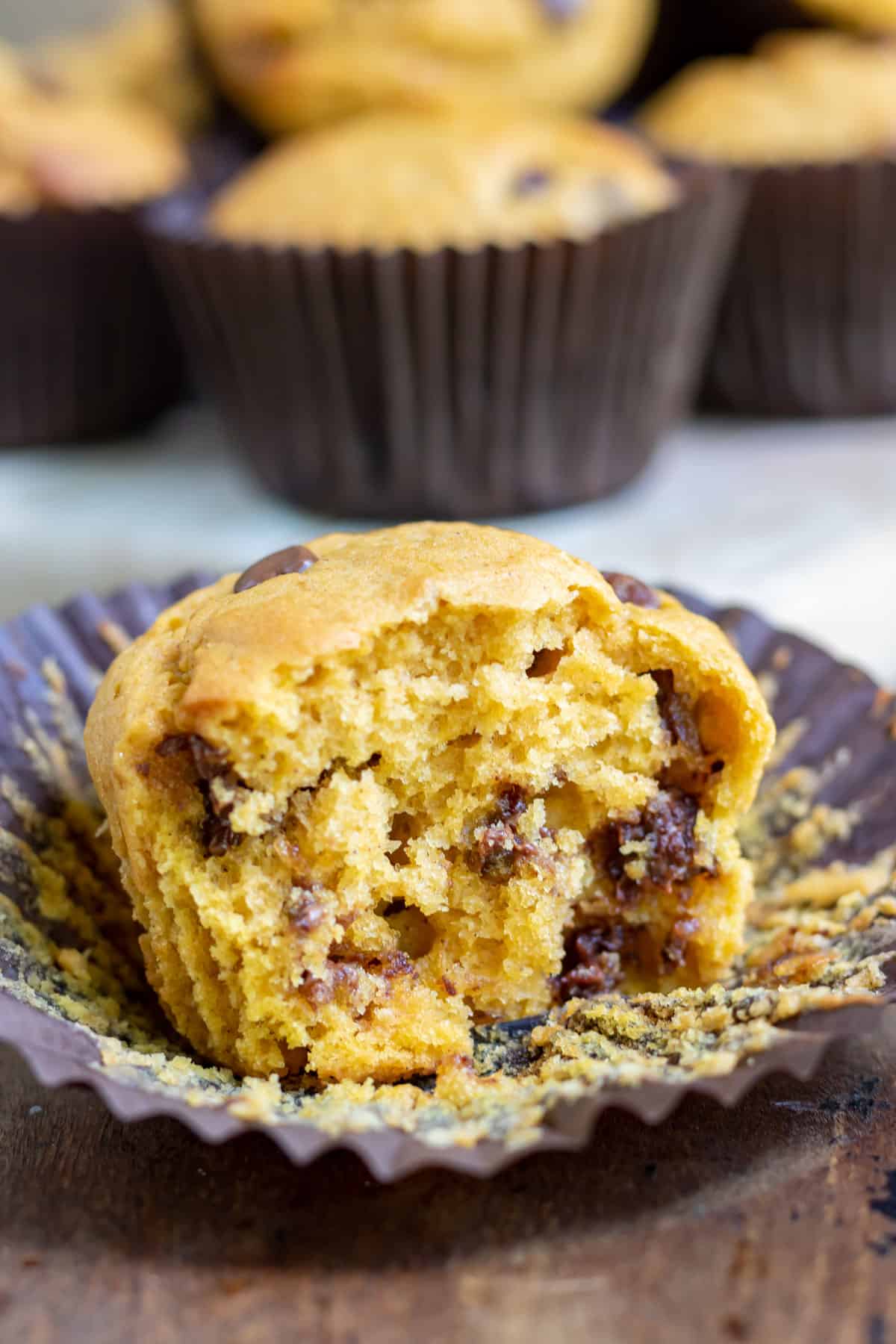 Close up of a muffin with a bite out.