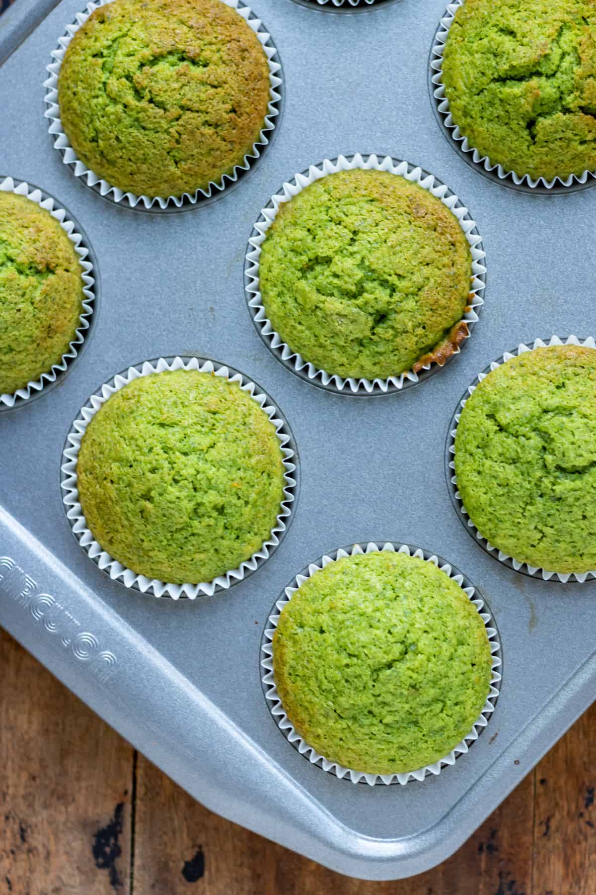 Cooked cupcakes in a muffin pan.