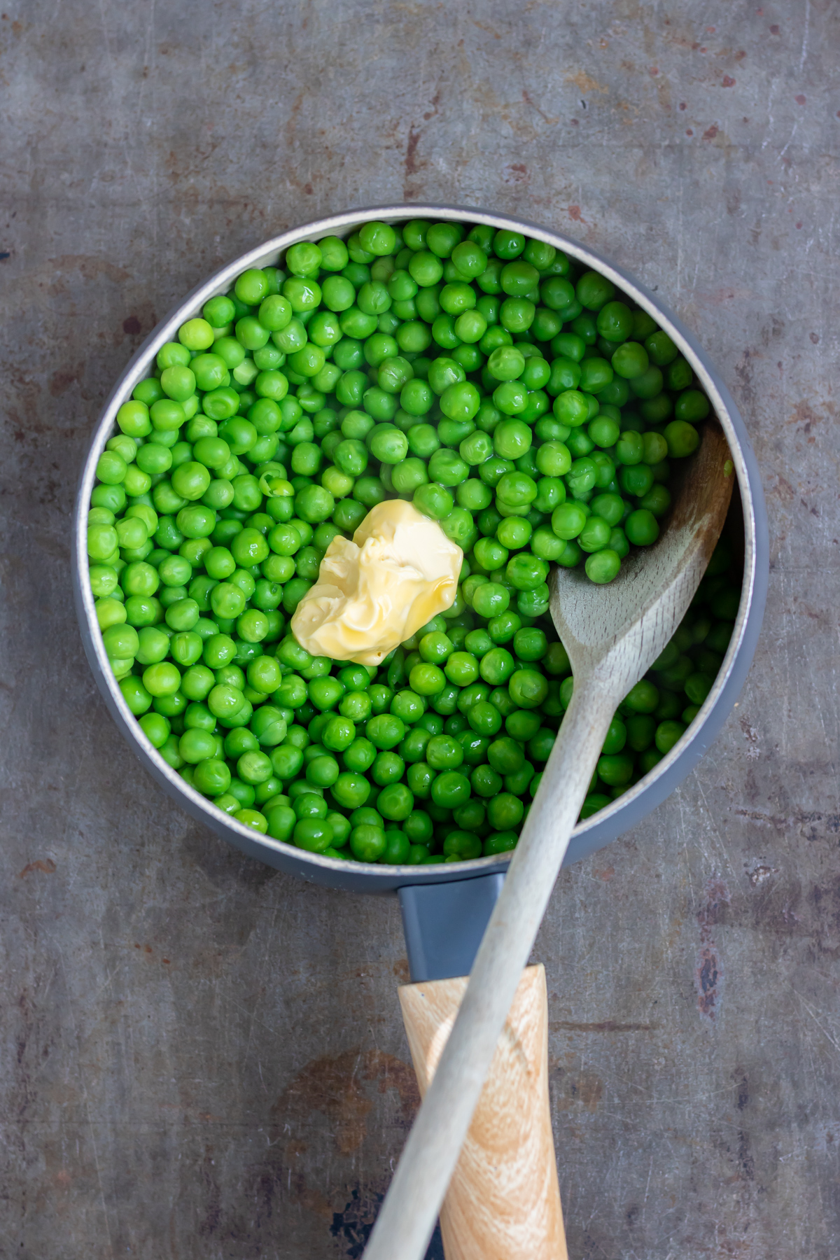 Butter stirred in and the peas slightly crushed.