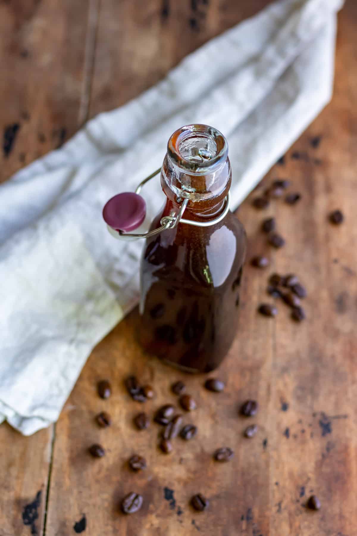 Looking down at a bottle of coffee flavored simple syrup.