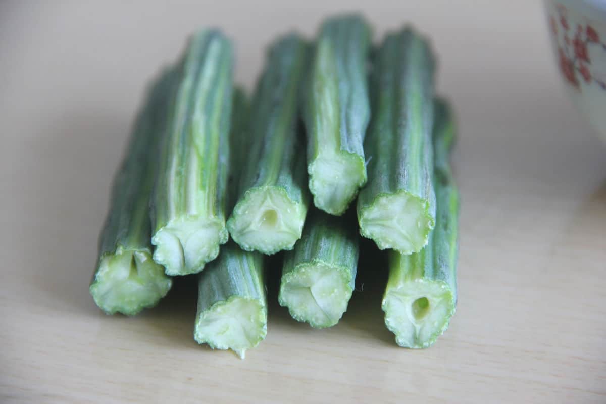 A pile of moringa drumstick plant slices on a table.