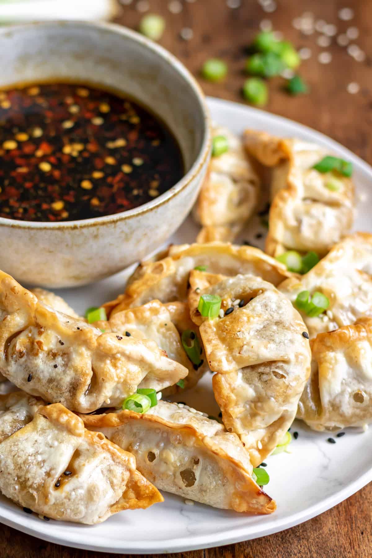 Close up of potstickers on a plate.