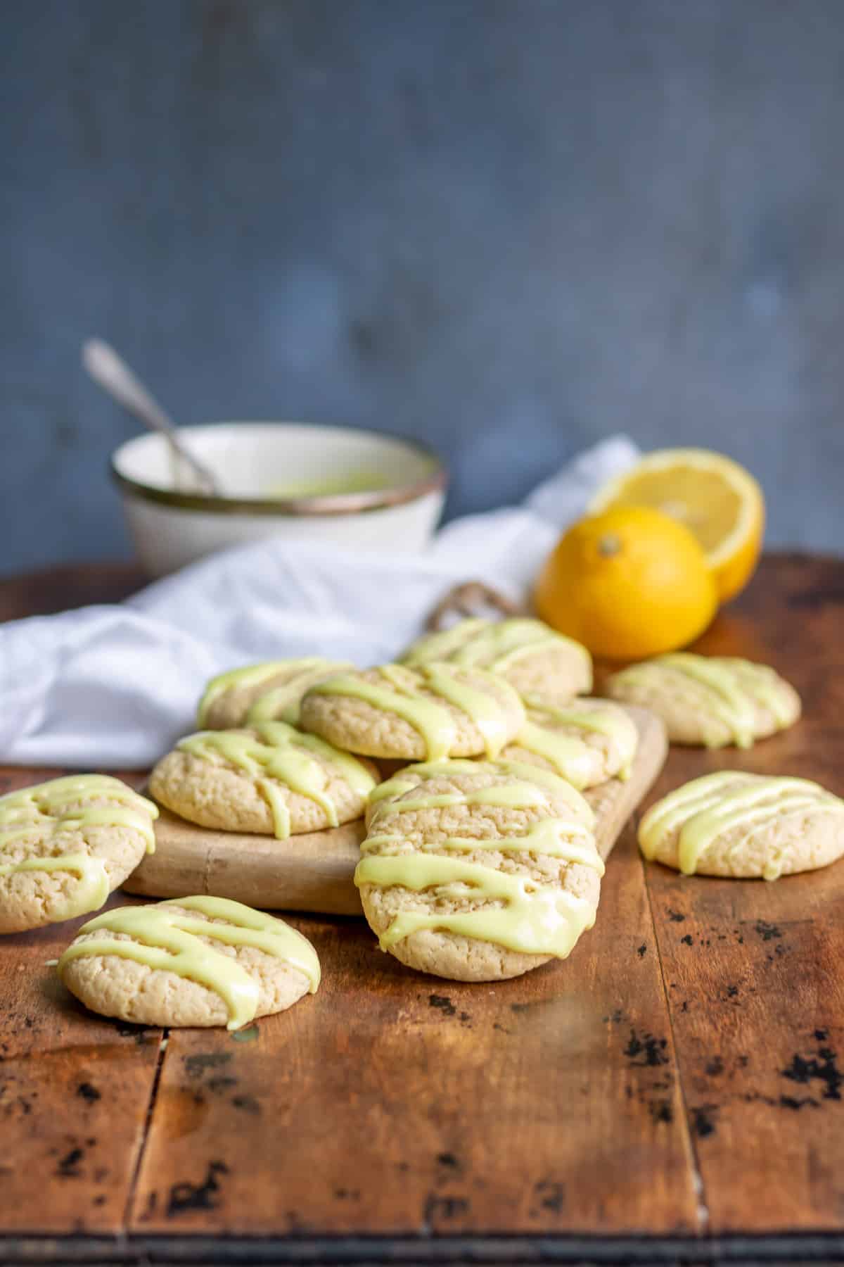 A table with a pile of lemon cookies.