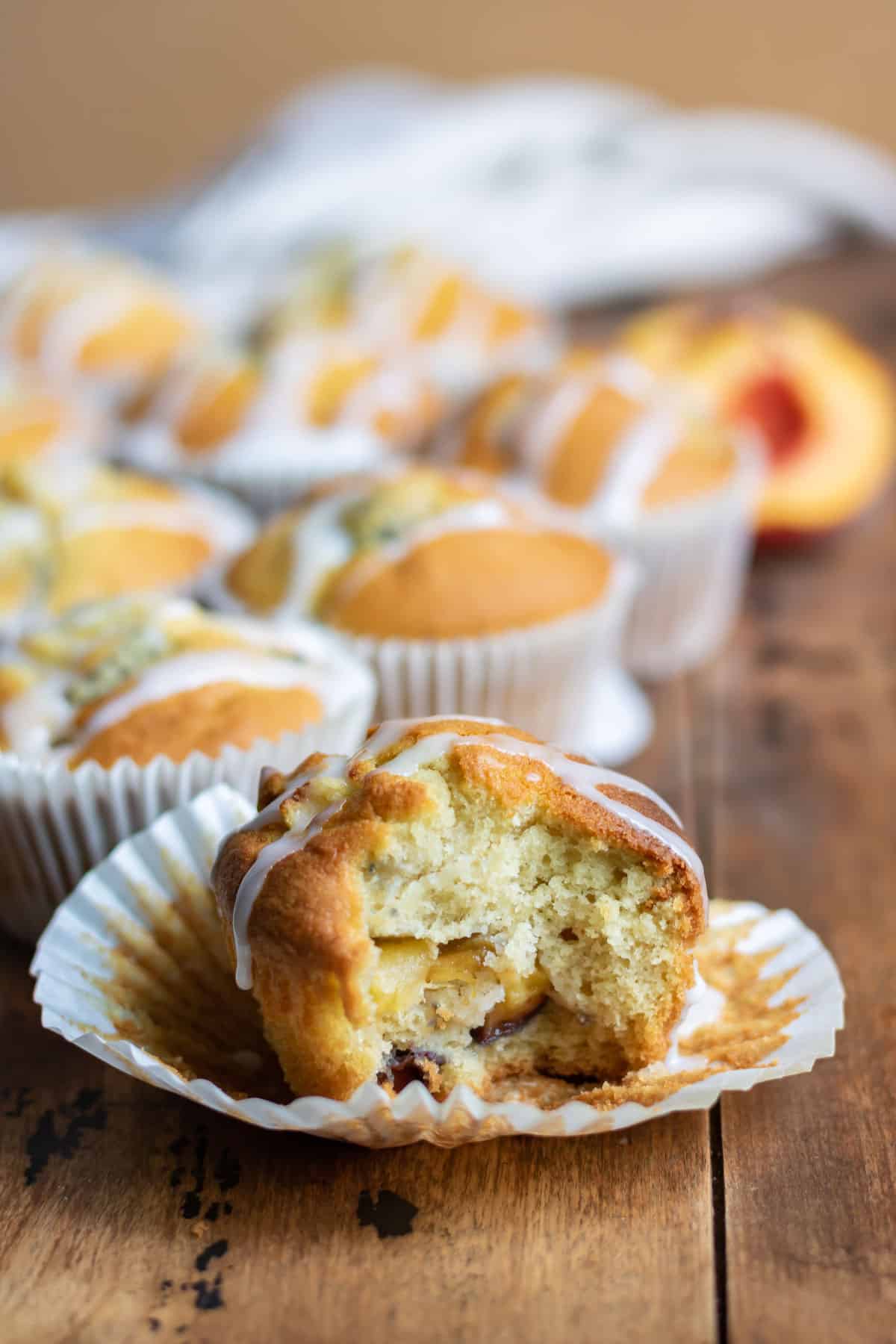 Bite out of a peach muffin.