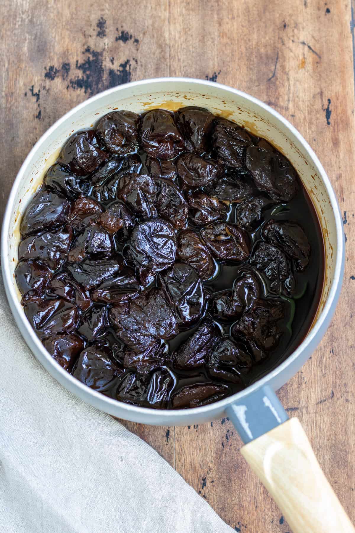 Pot of cooked prunes.