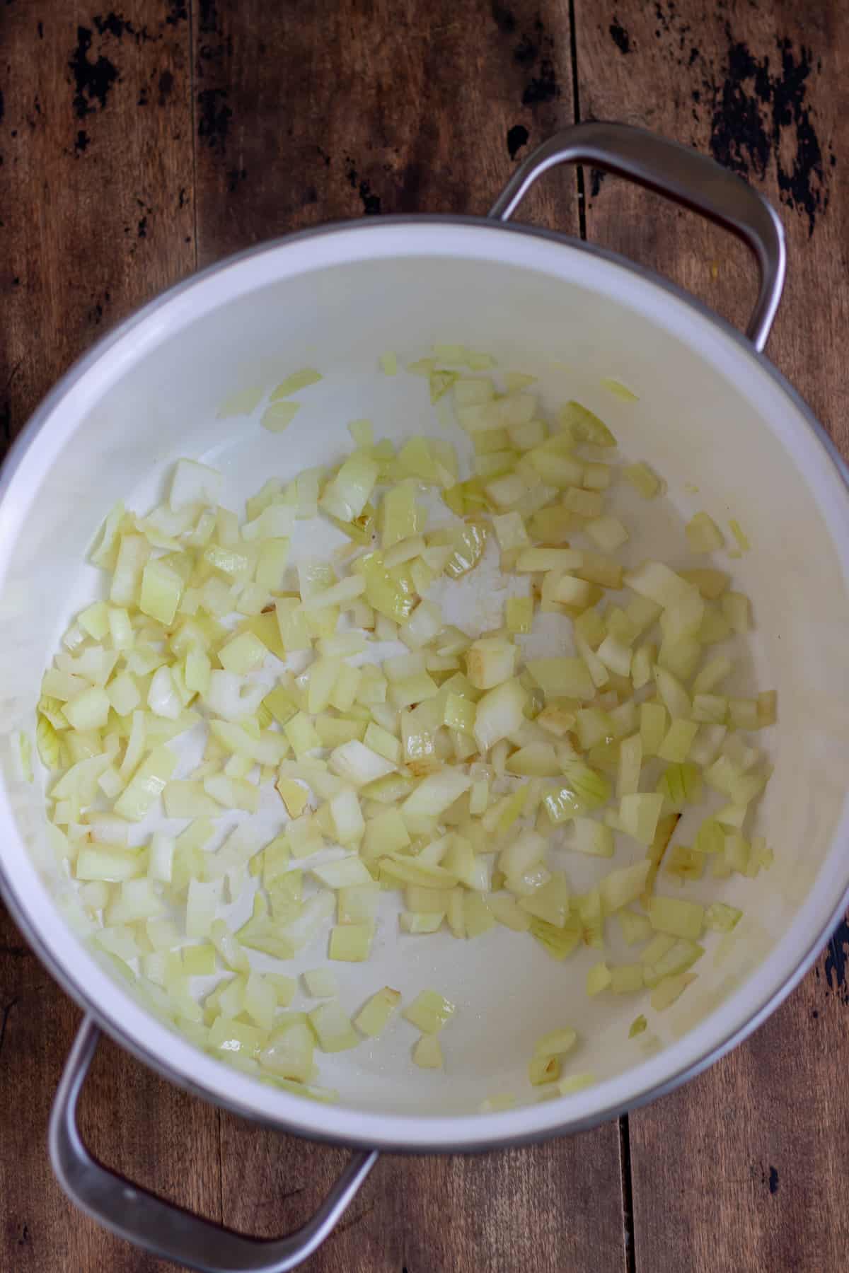 Onions cooking in a soup pot.