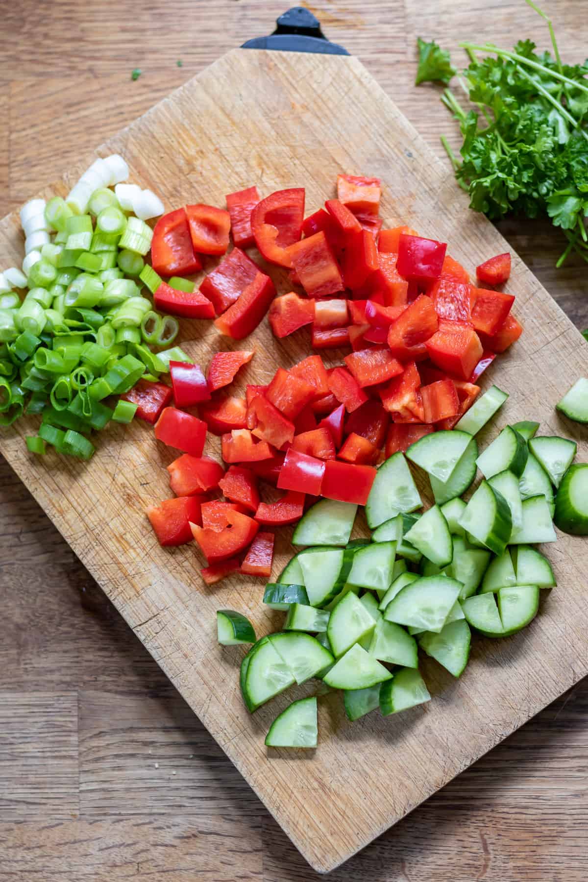 Chopped scallions, bell pepper and cucumber.