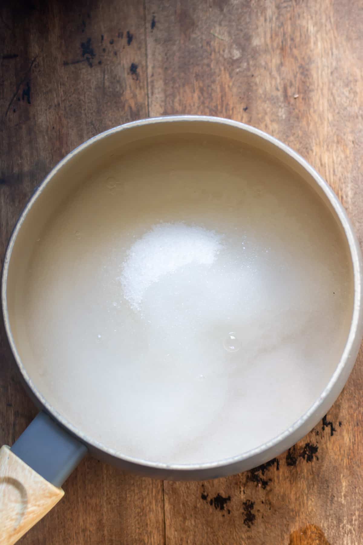 Water and sugar in a pot.