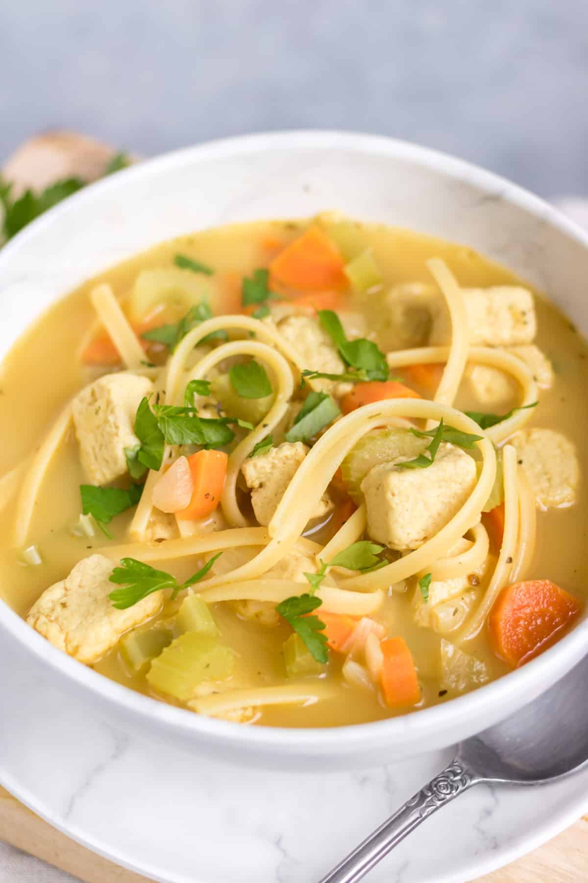 Close up of a bowl of vegan noodle soup.