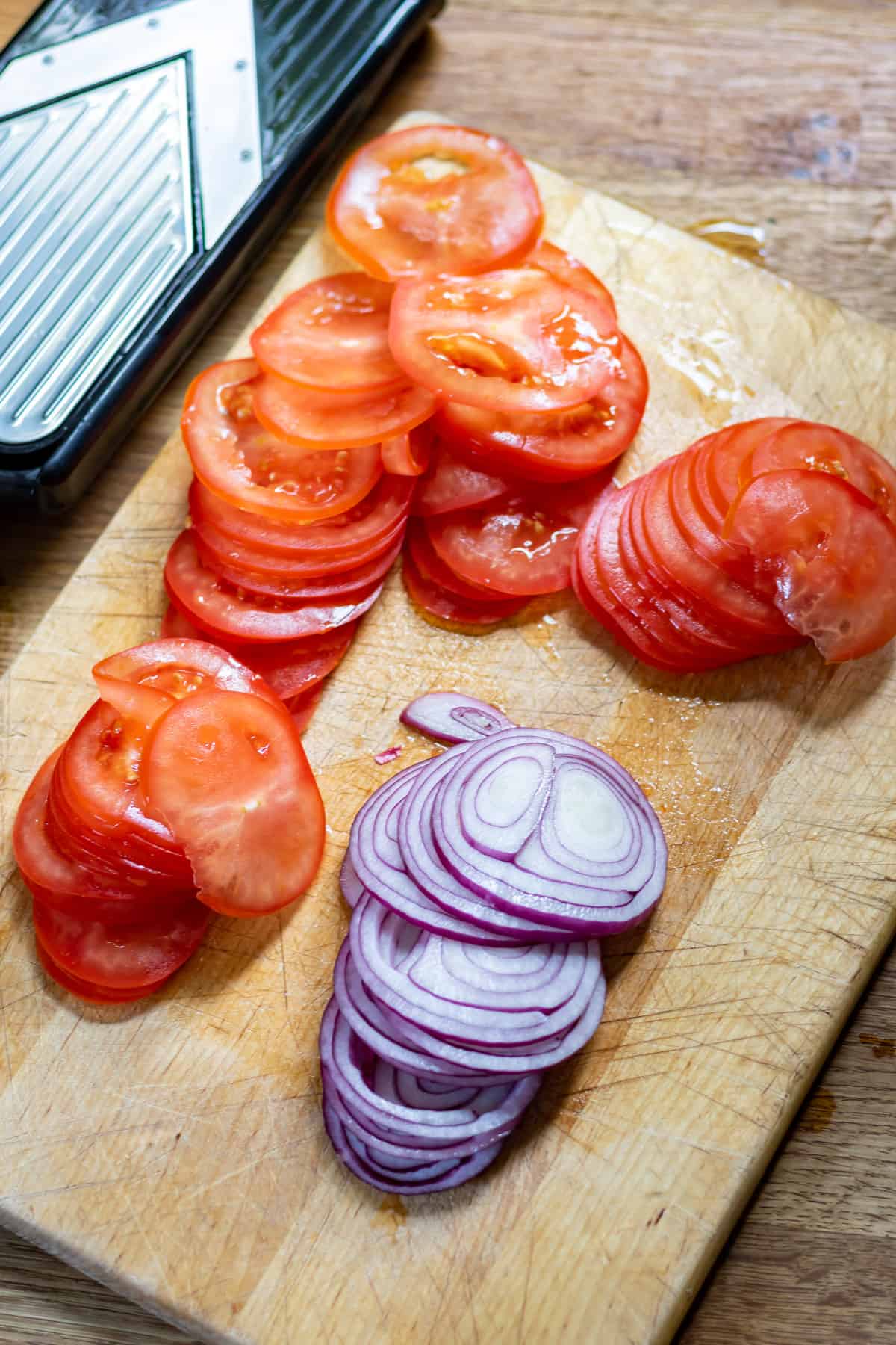 Slicing tomatoes and onions.