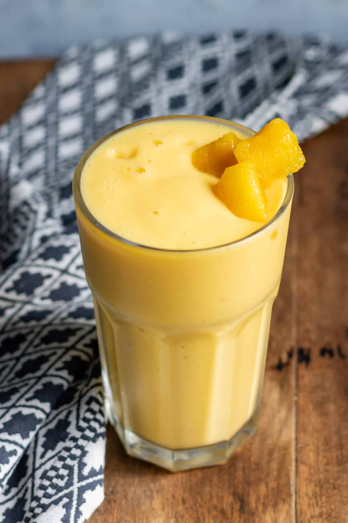 Glass of smoothie on a table.