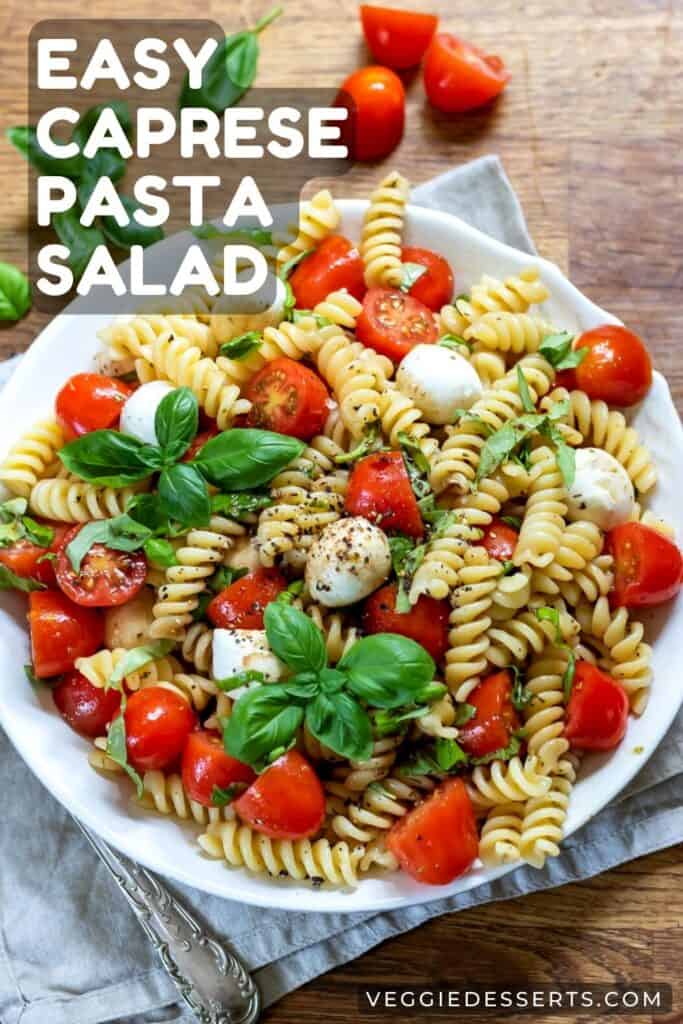 Plate of salad with text: Easy Caprese Pasta Salad.