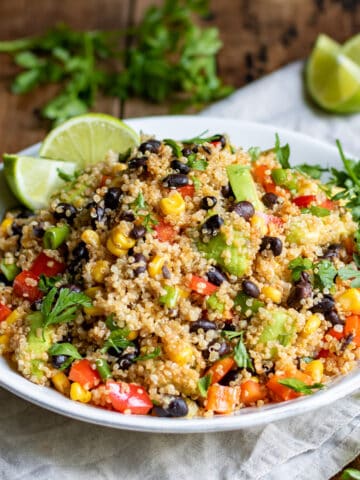 Table with a plate of quinoa and black beans.