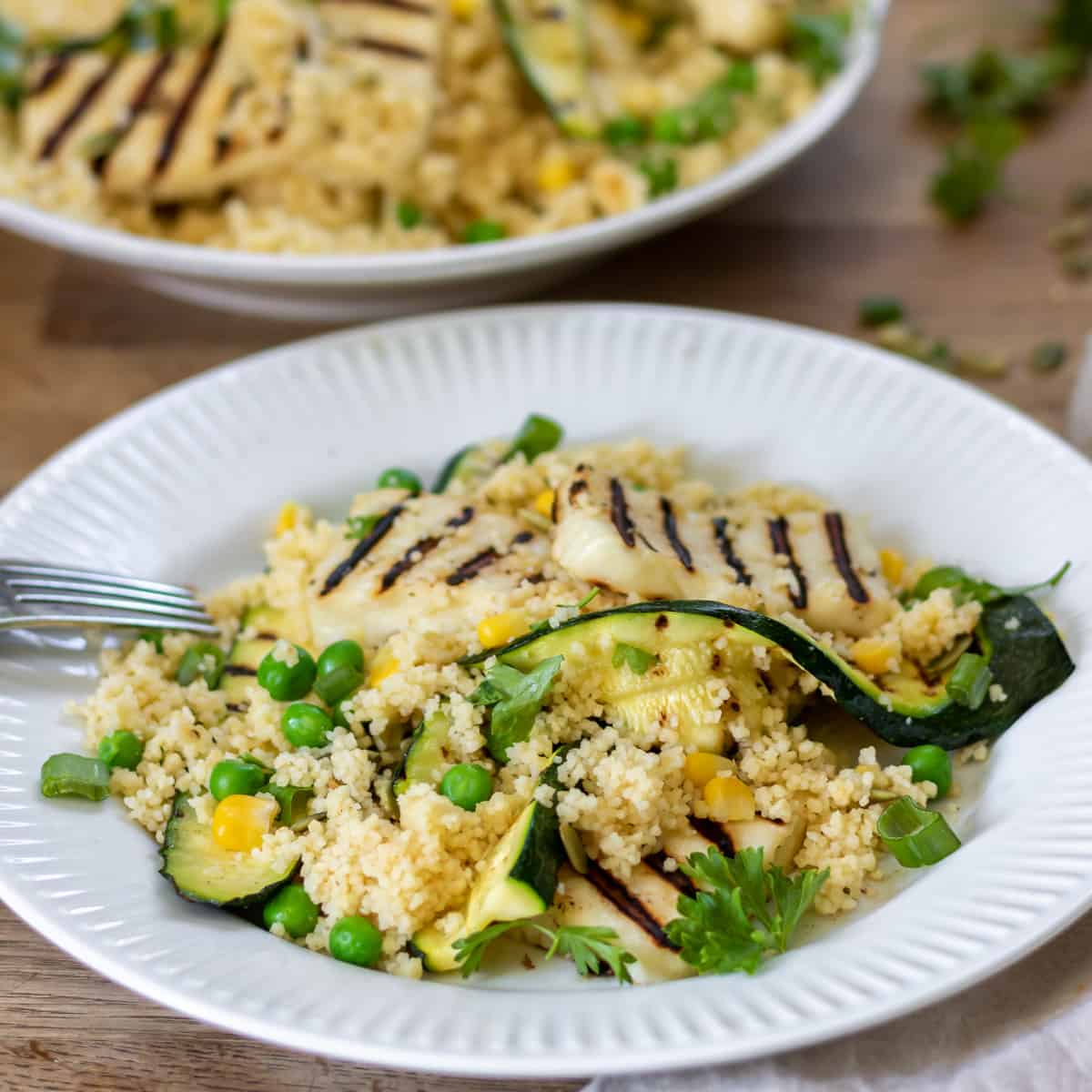 A plate of halloumi couscous with zucchini.