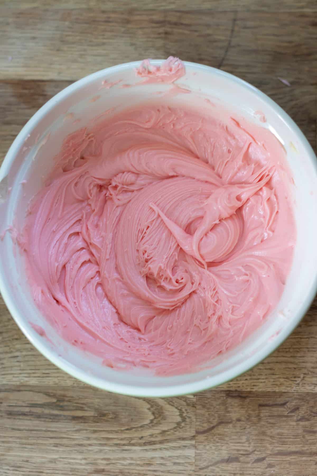 Bowl of pink frosting.