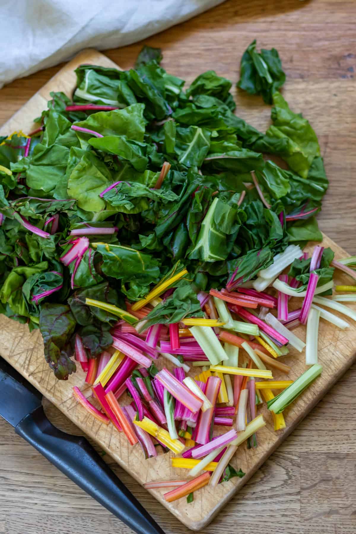 Chopping the chard leaves and stems.