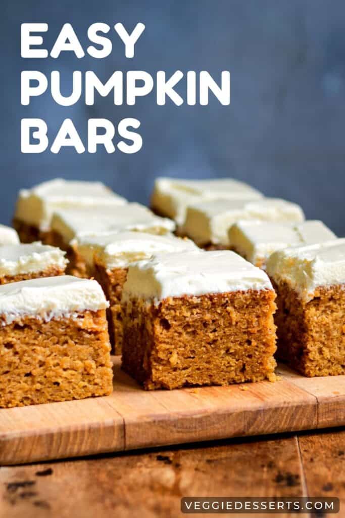 Rows of pumpkin bars topped with cream cheese frosting.