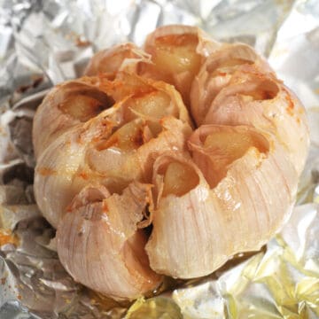A bulb of garlic roasted in foil.