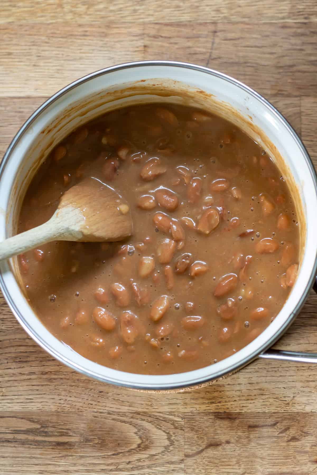Cooked pinto beans and sauce.