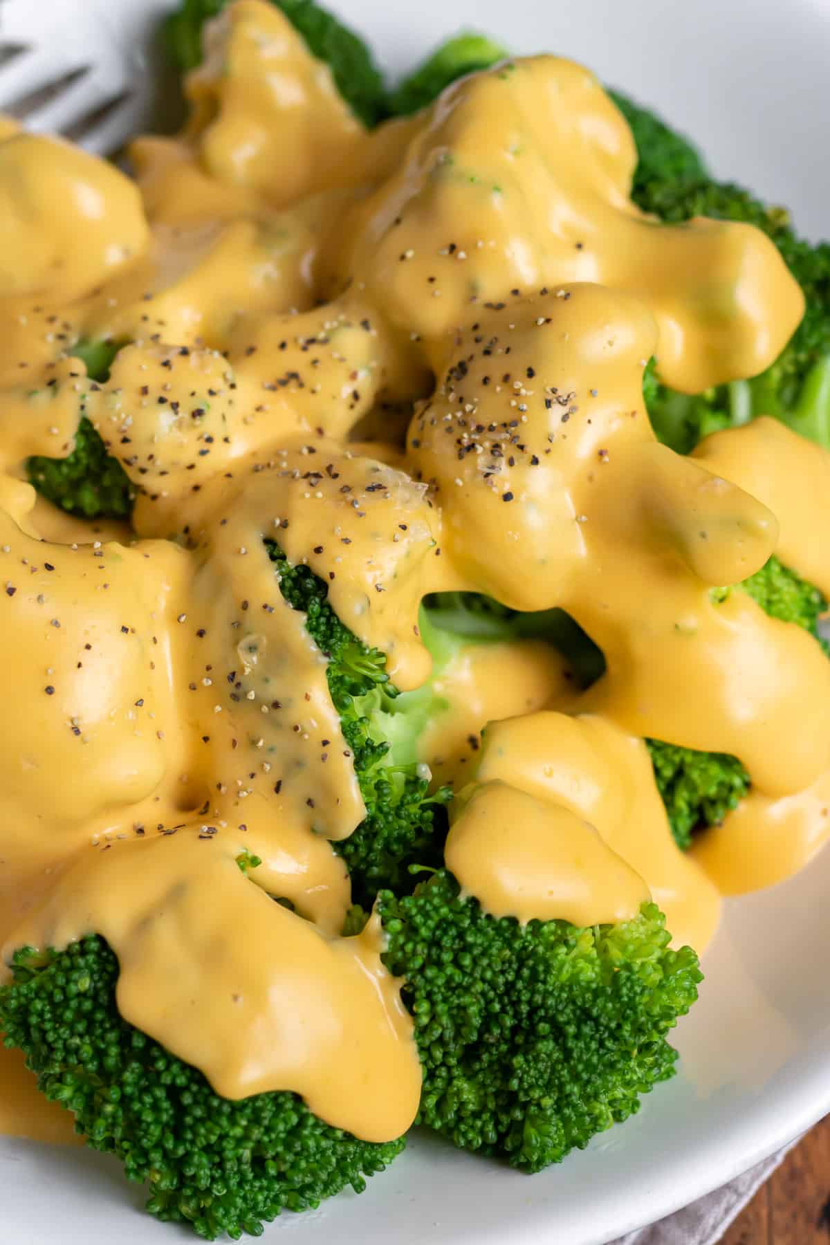 Close up of cheese sauce for broccoli.