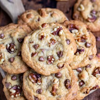 A pile of chocolate chip walnut cookies.