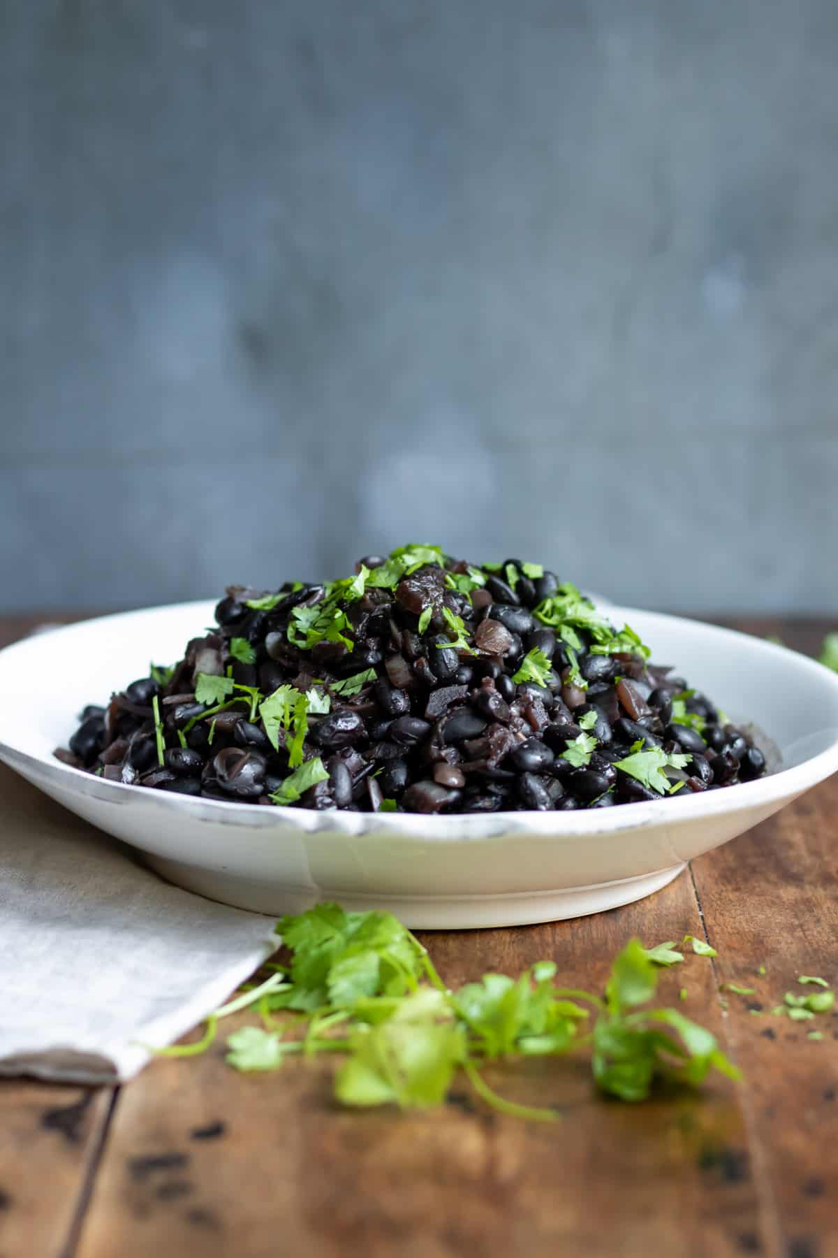 Serving dish of black beans cooked in a crock pot.