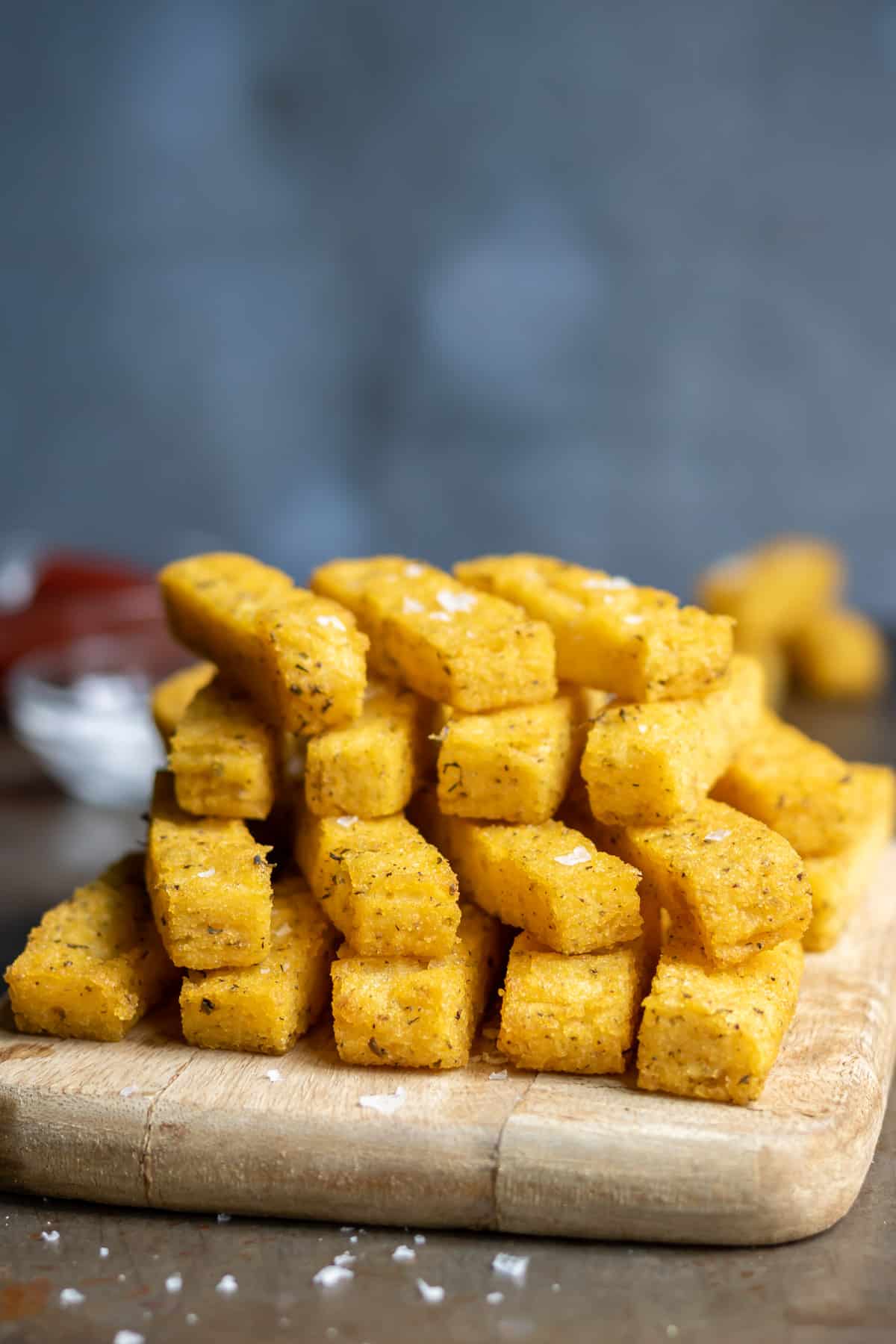 A stack of crispy baked polenta fries.