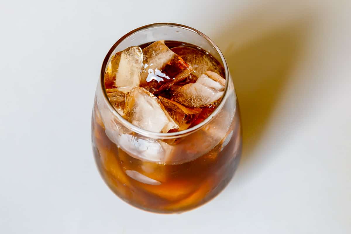 Glass of ice and caramel cold brew.
