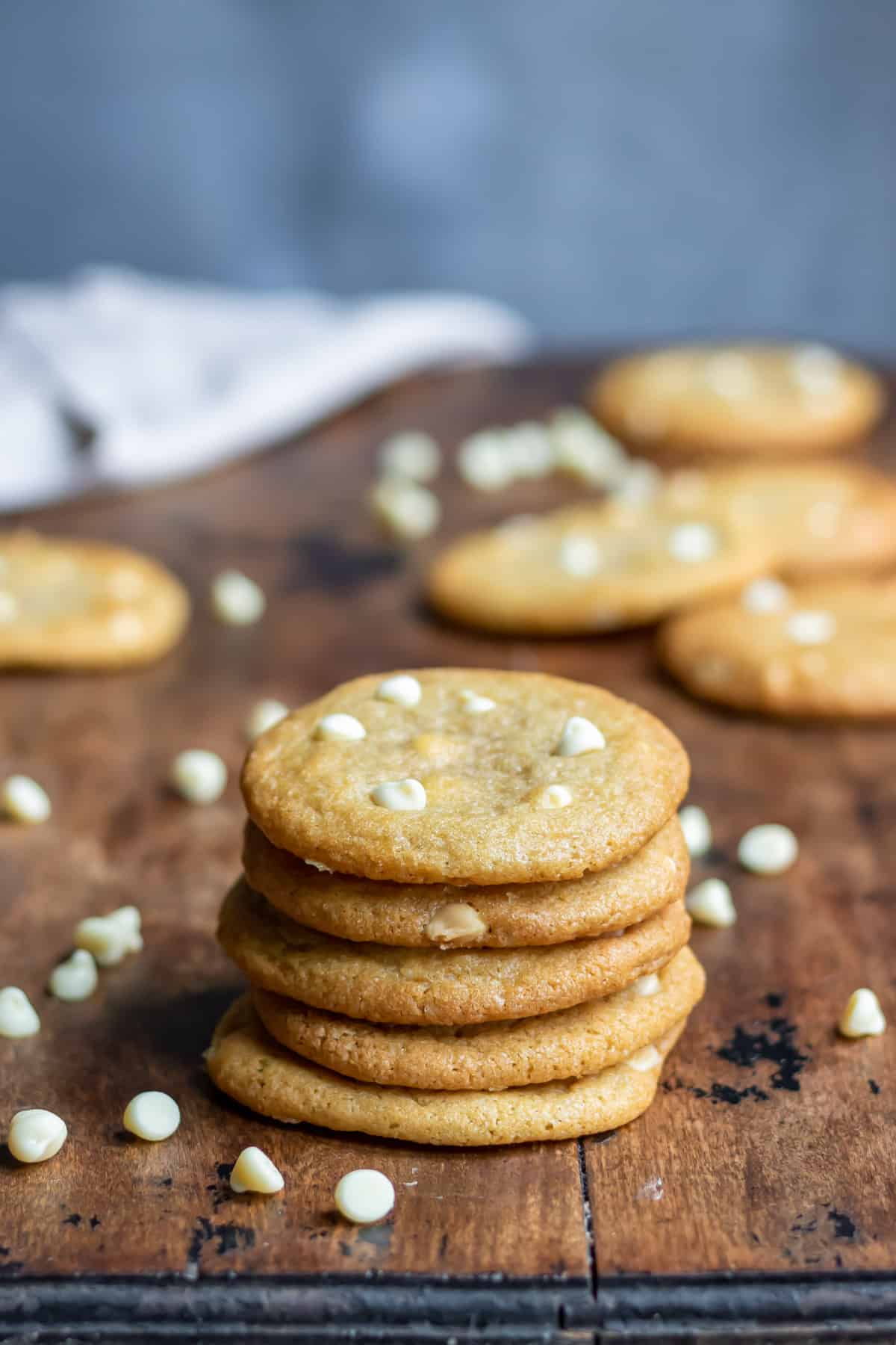 Stack of cookies with white chocolate chips.
