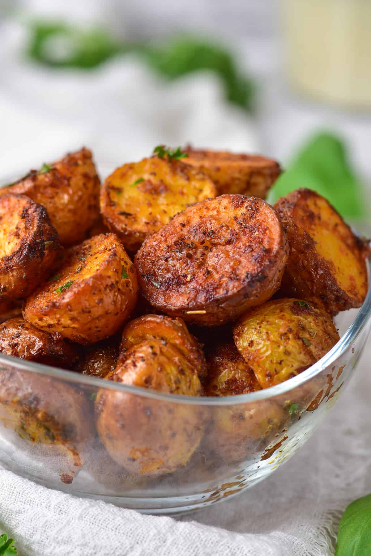Close up of a dish of air fryer roasted potatoes.
