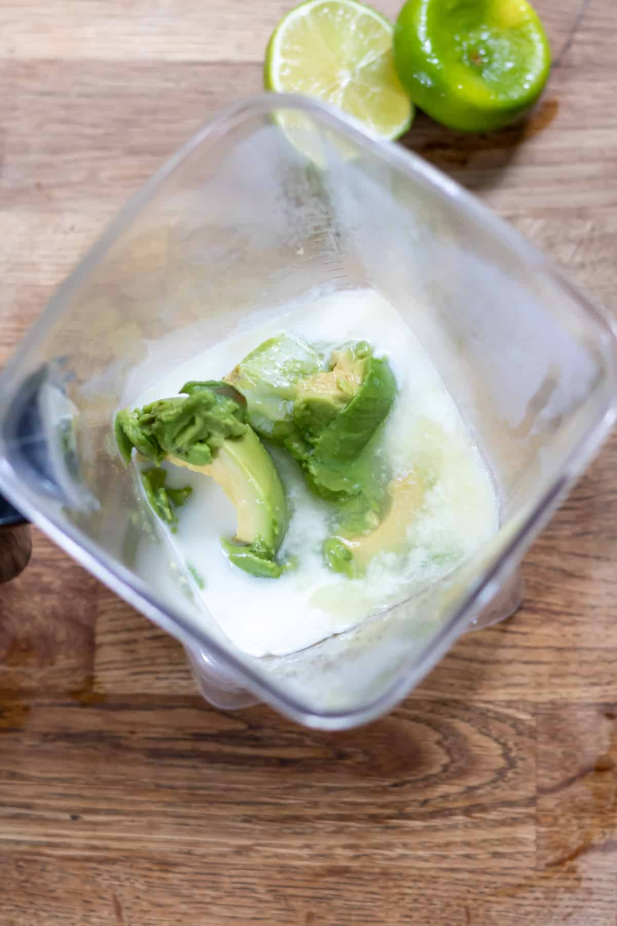 Coconut milk, lime juice, maple syrup and avocado in blender.